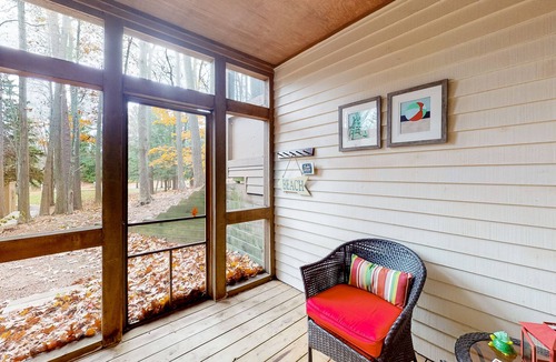Maple City Condo | Updated, charming condo near Lake Michigan with porch, washer/dryer, fireplace