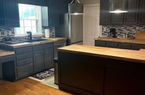 Madison House | Warm and cozy four bedroom home with fireplace.