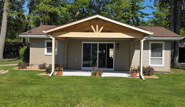Centrally located, four season retreat w/firepit and lakeview.