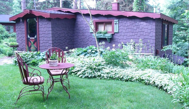 Enchanted Lakeside Cottage Nestled in Perennial Gardens