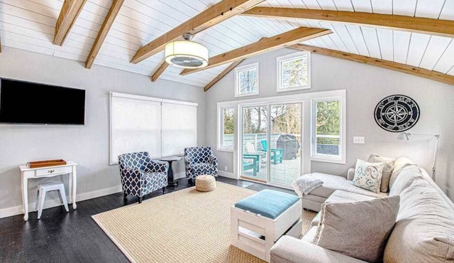 Fully-renovated lakefront home with beach cabana, association beach, & firepit