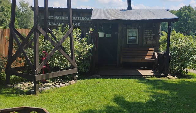 Hunting Cabin Rustic Handcrafted primitive sits in our unique rustic Cowboy Town