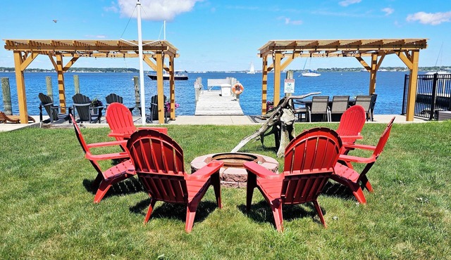Lakefront cottage on Muskegon Lake! Fire pit, 40' BOAT DOCK, near beach, shops
