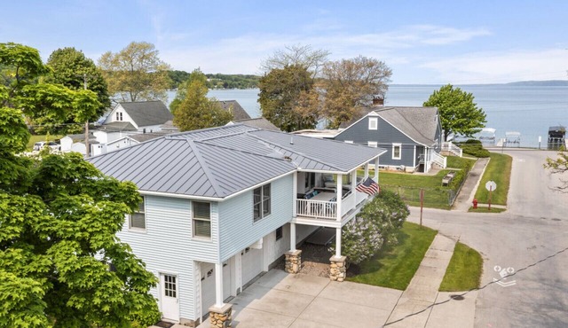 Modern-coastal retreat with lake views, covered deck, and walkable downtown Beulah location.