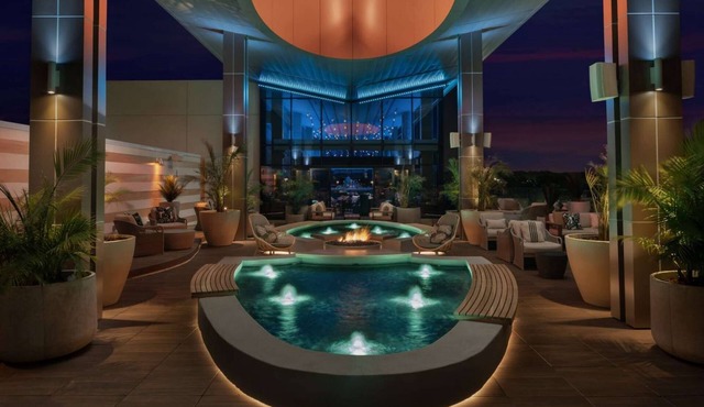 Next to Gas South Arena + Rooftop Bar. Pool. Gym.