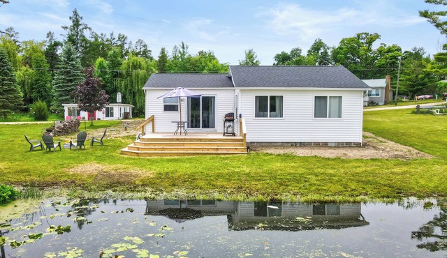 Peaceful 2-bedroom cottage on beautiful First Lake in Six Lakes, Michigan.