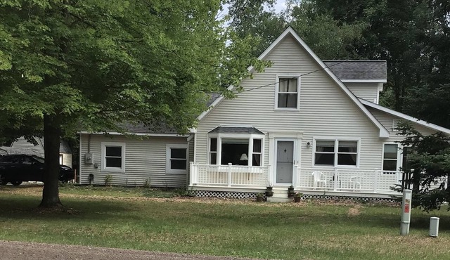 Roomy home with spacious fenced in backyard and fire pit.