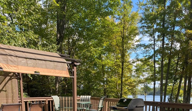 Secluded lakefront property, sand beach, water slide, kayaks, and paddleboards!