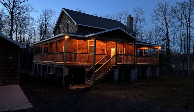 Six bedroom home with a hot tub, pool and an outdoor bar on a two acre lot.