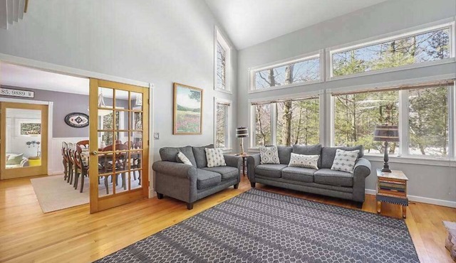 Spacious home with studio, lake access, sunroom, fireplace, W/D, & central AC
