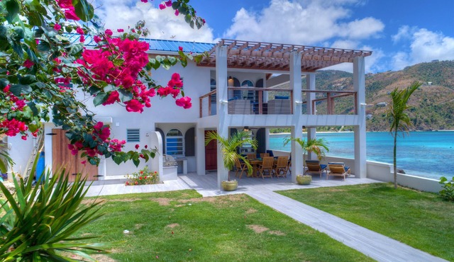 Unique beach front property steps away from the beautiful waters of brewers bay. in Brewers Bay