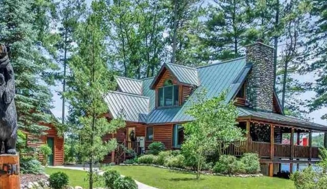 Unique log cedar family vacation home with 185 feet of secluded lake frontage