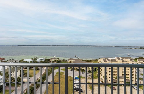 Pensacola Beach Condo | Spacious, open layout floor to ceiling with a wrap around balcony - ED1250